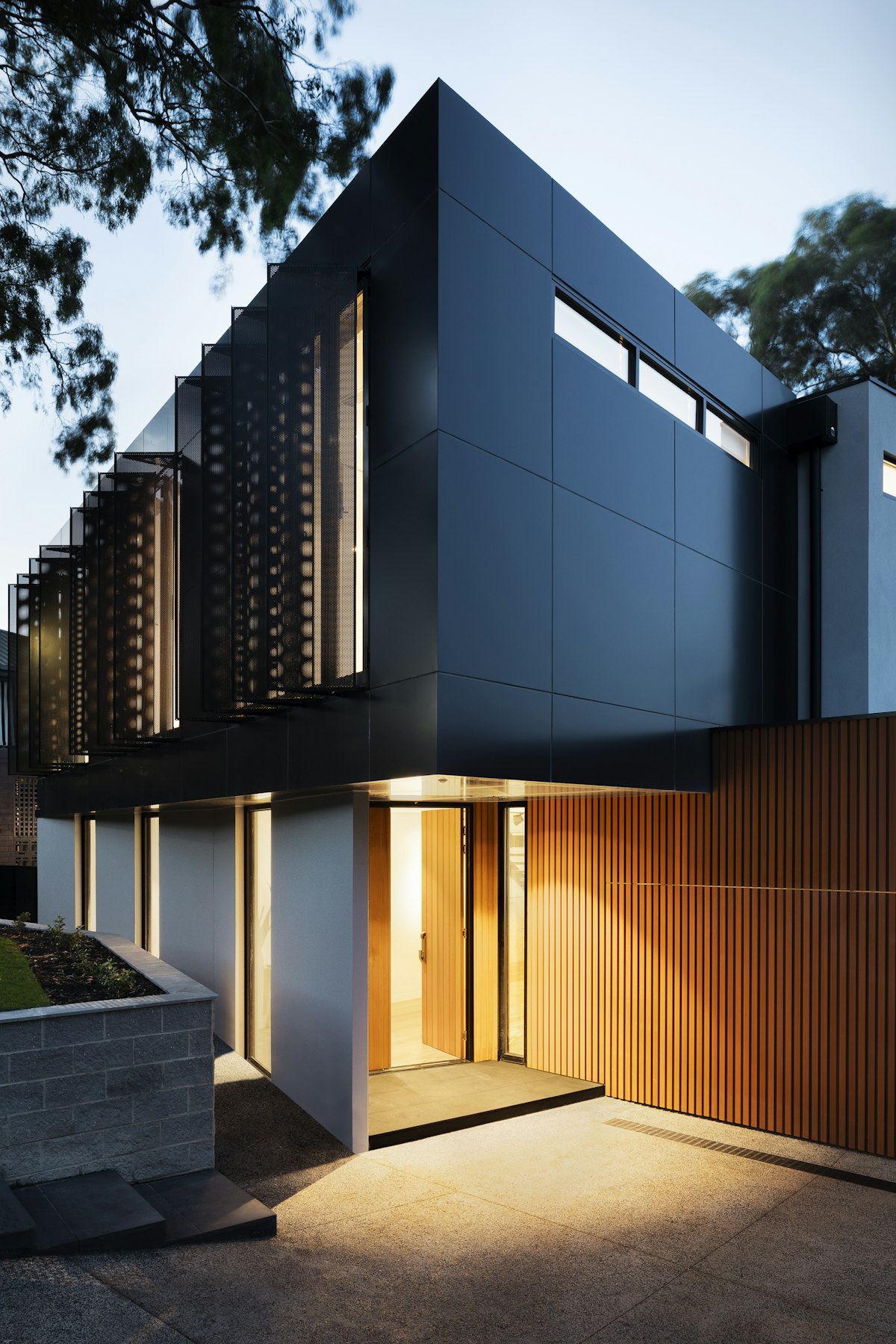 A warm home opening onto a planted garden